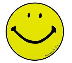 A simple yellow circle with two black oval eyes and a curved smile, representing the iconic Harvey Ball smiley face design from 1963