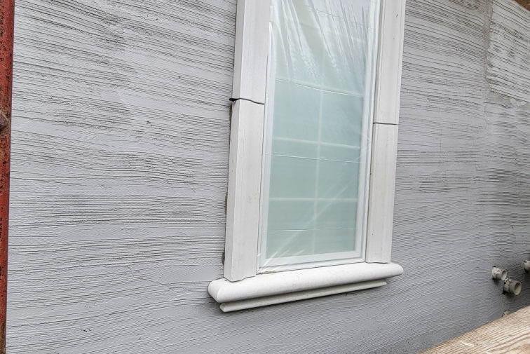 Pre-cast Tuscan window detail installation in Long Grove Illinois exterior renovation project