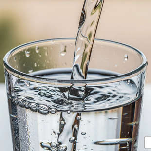 Healthy water intake with a glass of clean filtered drinking water