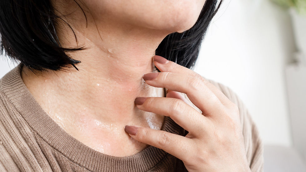 Woman experiencing hot flashes due to low Estrogen