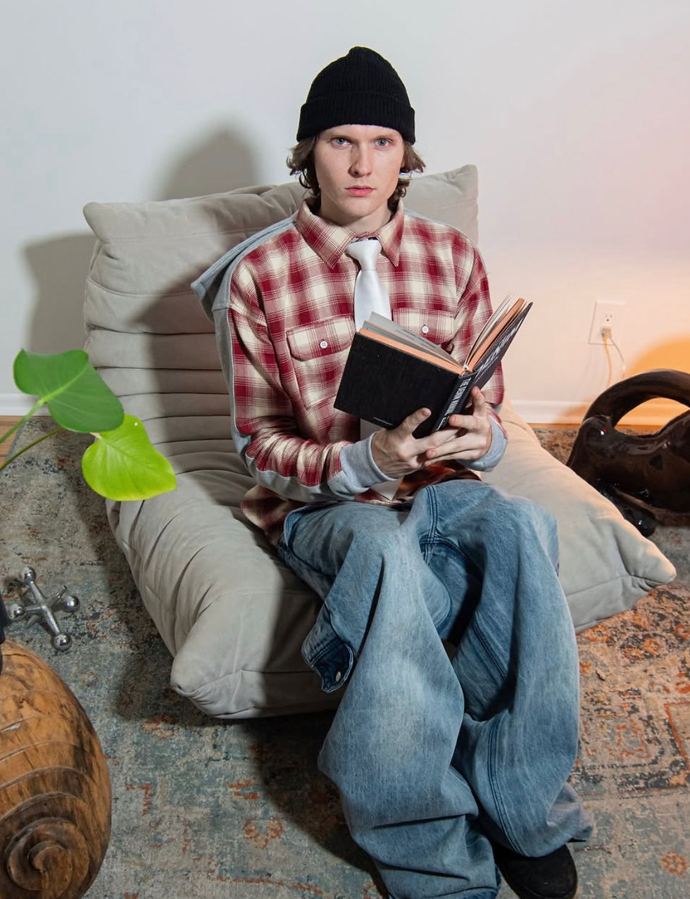 Patchwork hoodie made from recycled flannel and denim by Thanks Bill, styled with graffiti background.


