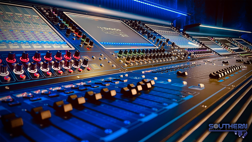 Eye-level view of professional audio mixing console in a control room