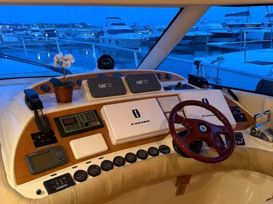 Flybridge helm wheel and console with sea views aboard the Humilitas I yacht