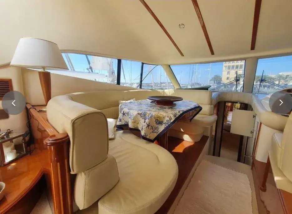Salon seating with sea-view windows aboard the Humilitas I luxury yacht