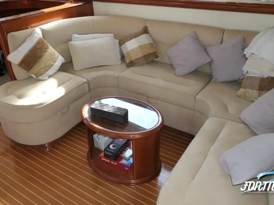 Salon with curved sofa aboard the Humilitas I charter yacht, Chasing Blue