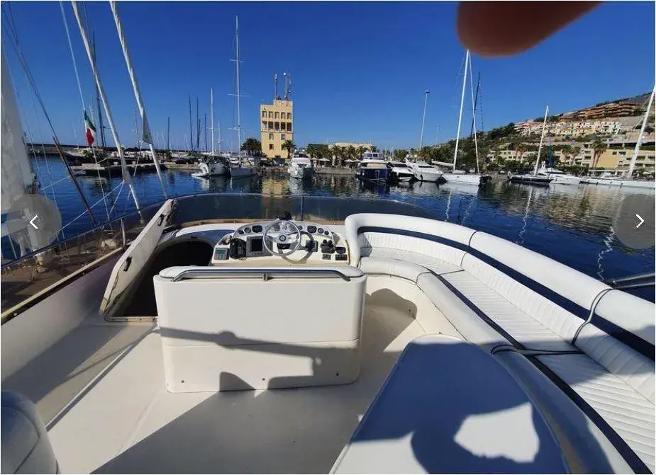 Aft flybridge deck of the Humilitas I yacht overlooking the marina, Costa Daurada