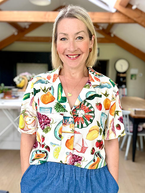 Ali wearing a shirt and trousers that she made