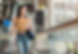 gorgeous-young-asian-female-tourist-passenger-is-airport-escalator-carrying-her-luggage.pn
