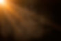 orange spotlight on stage or gods rays isolated on black background.jpg
