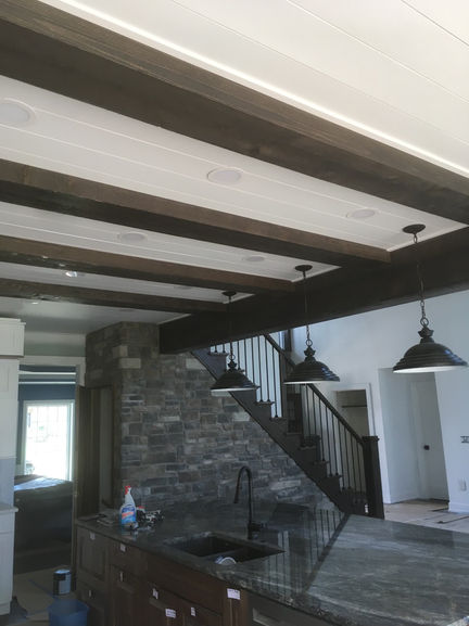 This customer wanted their  ceiling beams to have the same rich, dark wood finish as their kitchen. We delivered a seamless match, creating a cohesive, elegant look that ties the entire space together.