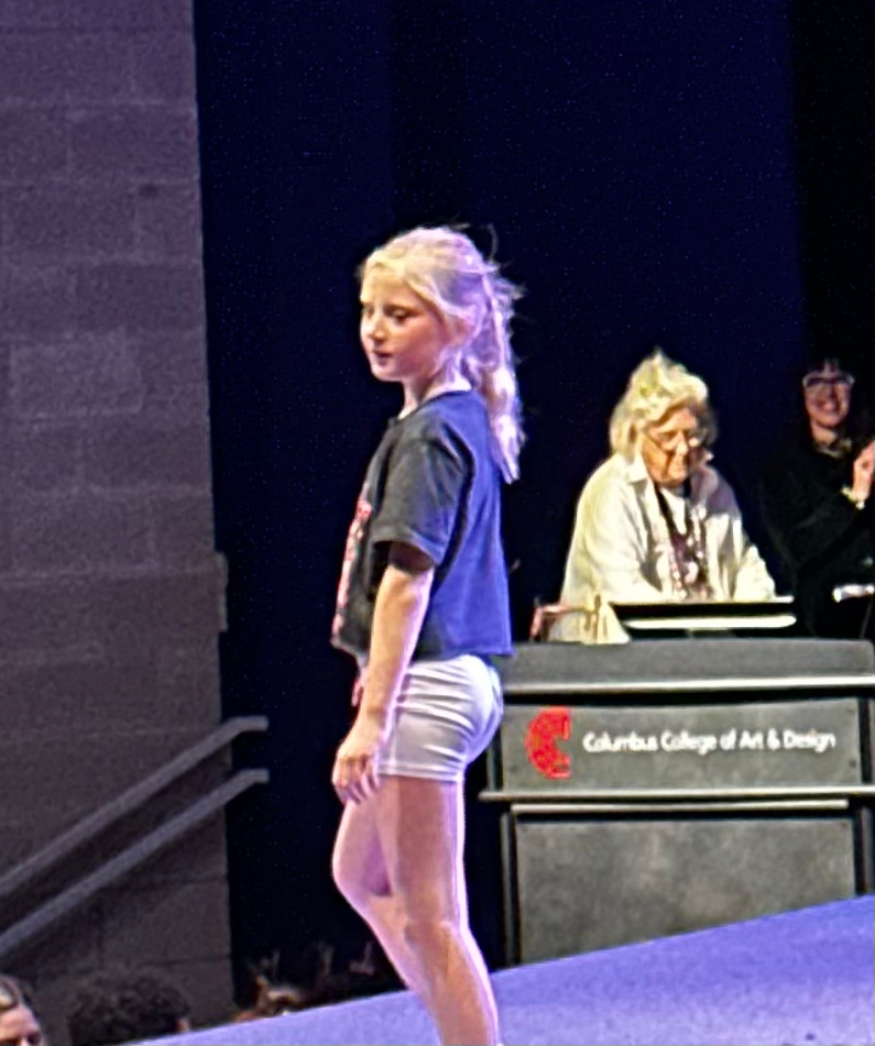 She took part in a cook after school activity where they repurposed clothing and sewed interesting things together to repurpose clothing into new fashion.  At the end of the session, they put on a whole show.  It was fantastic.  