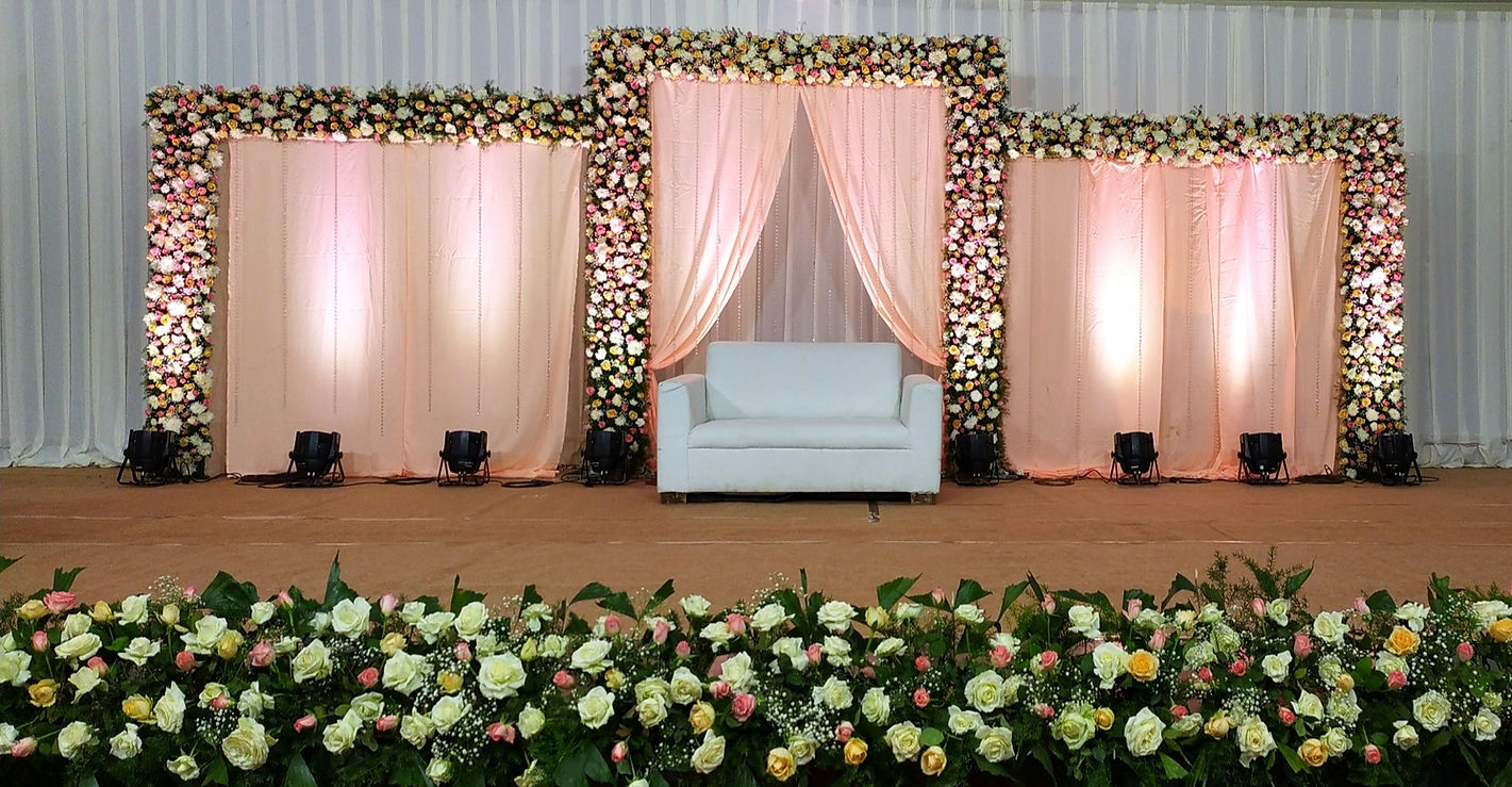 Pink themed Reception Backdrop made of Roses, Baby Breath and Foliage
