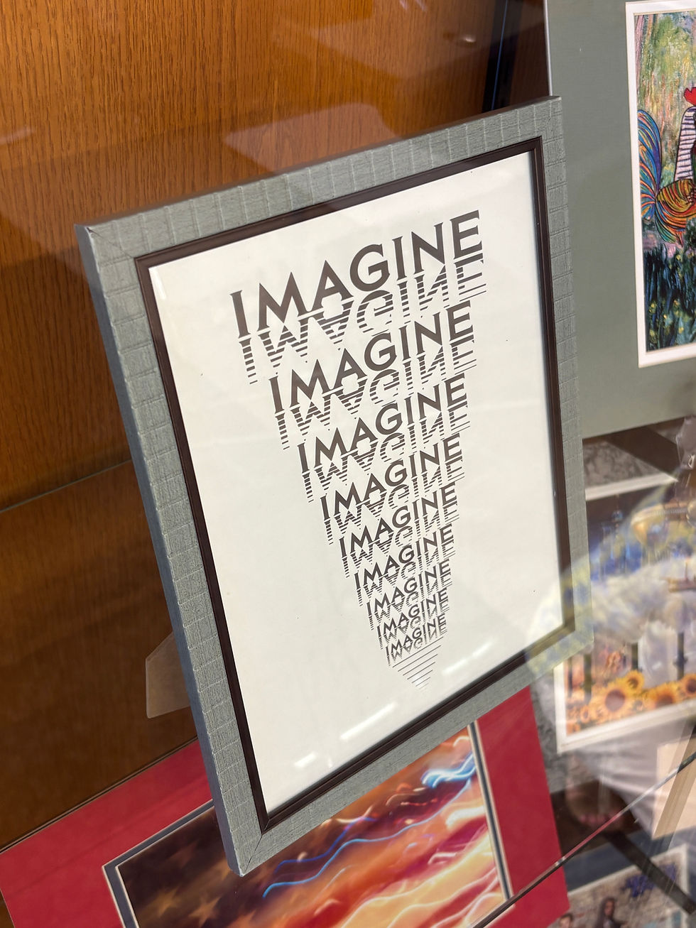 The title sign for "Imagine"