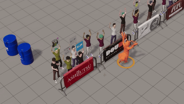 People cheering behind barriers with banners in a large room. An orange creature in front is waving. Blue barrels are nearby. Energetic mood.