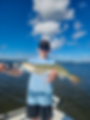 kid poses with a nice trout caught on an estero bay fishing charter