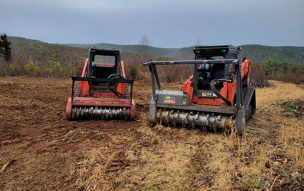 Kubota skid steers with Fecon mulchers used by HCS Land Management for land clearing in Virginia.