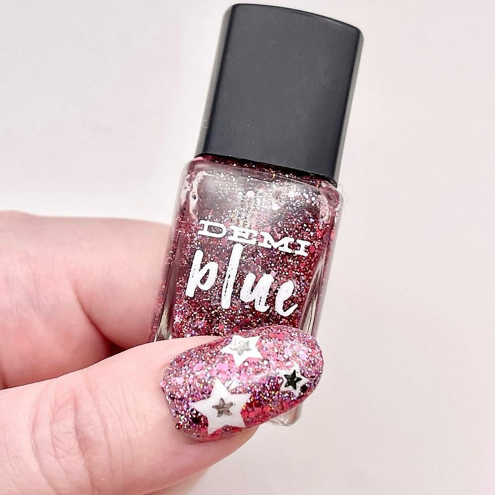 Thumbnail: red shimmer vegan nail polish DEMIblue Hot Rocs bottle
