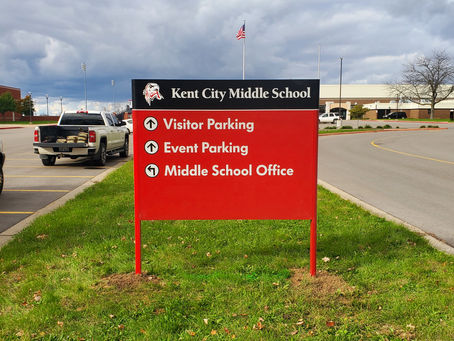 Directional signs are critical for school traffic flow.