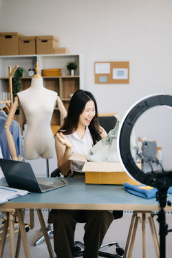 asian-lady-blogger-showing-clothes-in-front-of-the-2024-02-29-02-23-55-utc