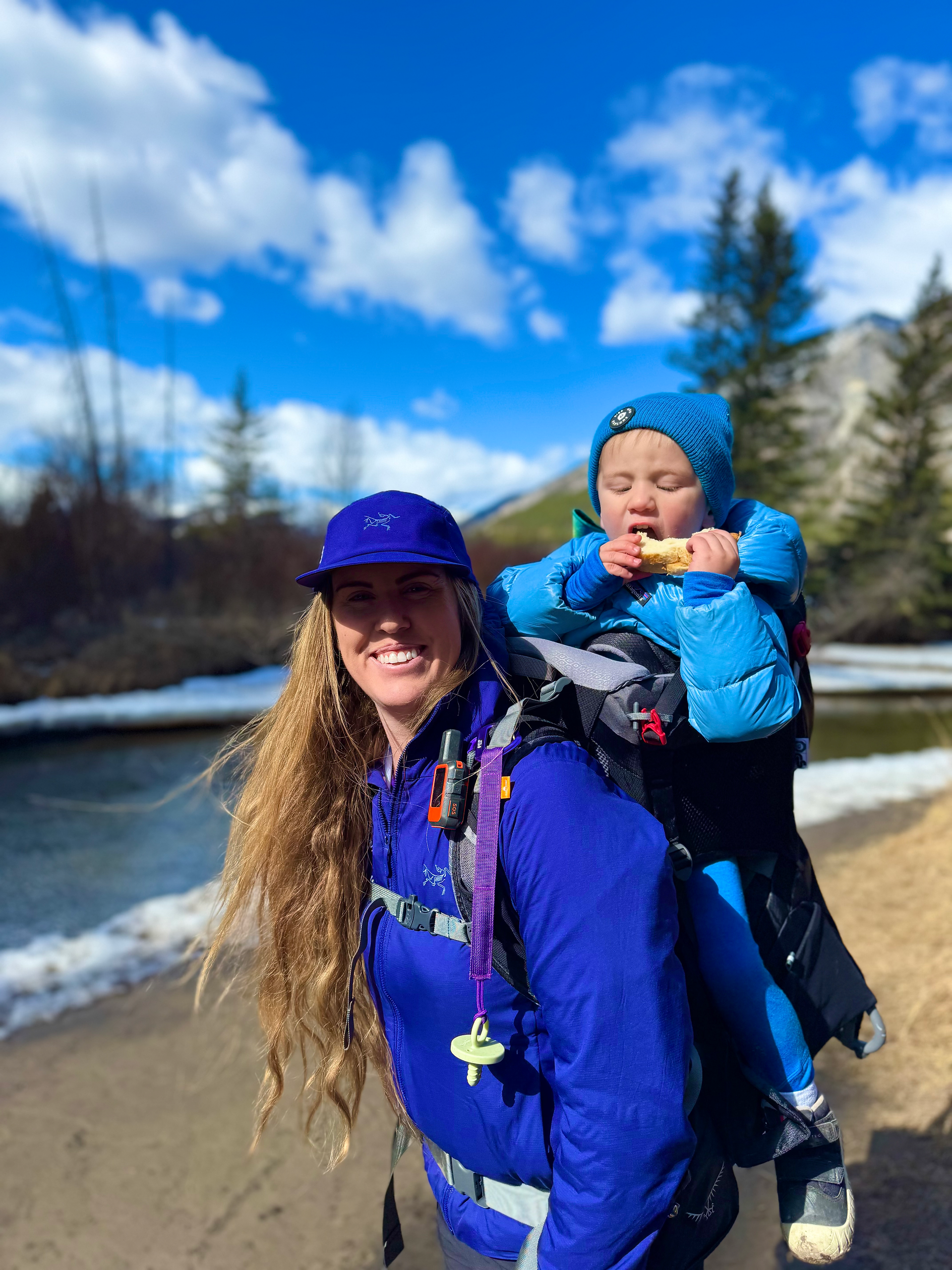 hiking mom and kid in Banff on back of a carrier