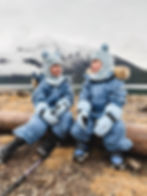 A mom with her two toddlers wearing Reima Fall hiking layers in the Canadian Rockies