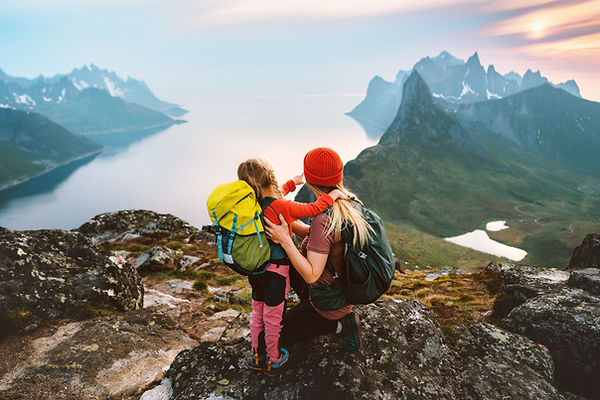 Mother hiking with kid daughter family travel hobby active vacations outdoor in Norway hea