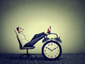 woman relaxing with feet up on clock