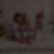 Scene_ A cozy, pastel setup in a living room with three 5 year old girls sitting on plush