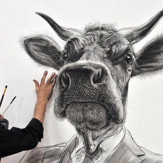 Valeriu Mladin in his studio, working on monumental drawings from the Political Bestiary series; documentary images taken over 12 years, capturing the working atmosphere, the scale of the studio, the creative process and the charcoal technique, with hybrid figures combining human bodies and animal heads.