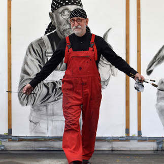 Valeriu Mladin in his studio, working on monumental drawings from the Political Bestiary series; documentary images taken over 12 years, capturing the working atmosphere, the scale of the studio, the creative process and the charcoal technique, with hybrid figures combining human bodies and animal heads.