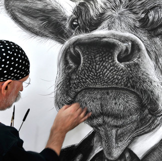 Valeriu Mladin in his studio, working on monumental drawings from the Political Bestiary series; documentary images taken over 12 years, capturing the working atmosphere, the scale of the studio, the creative process and the charcoal technique, with hybrid figures combining human bodies and animal heads.