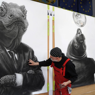 Valeriu Mladin in his studio, working on monumental drawings from the Political Bestiary series; documentary images taken over 12 years, capturing the working atmosphere, the scale of the studio, the creative process and the charcoal technique, with hybrid figures combining human bodies and animal heads.
