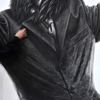 Valeriu Mladin in his studio, working on monumental drawings from the Political Bestiary series; documentary images taken over 12 years, capturing the working atmosphere, the scale of the studio, the creative process and the charcoal technique, with hybrid figures combining human bodies and animal heads.