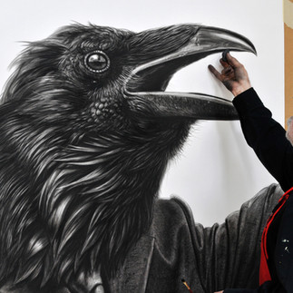 Valeriu Mladin in his studio, working on monumental drawings from the Political Bestiary series; documentary images taken over 12 years, capturing the working atmosphere, the scale of the studio, the creative process and the charcoal technique, with hybrid figures combining human bodies and animal heads.