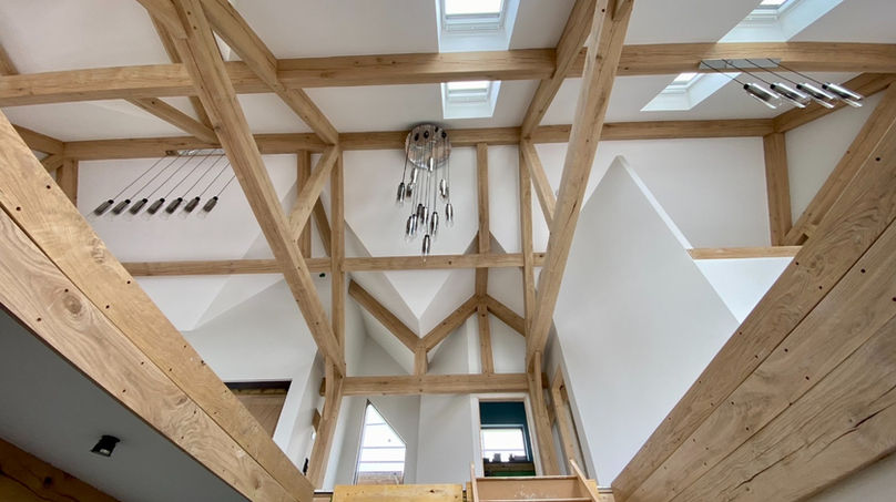 Wooden beams and white walls form the interior of Oak Frame Homes. Architecture concept.