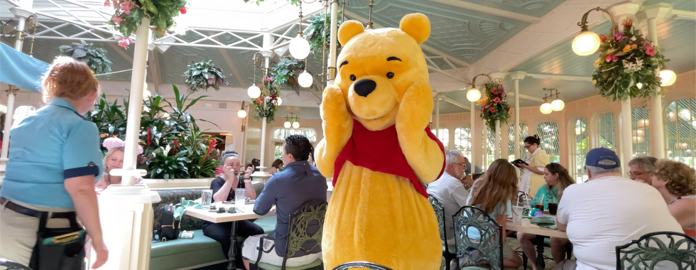 Winnie the Pooh character dining in the Crystal Palace