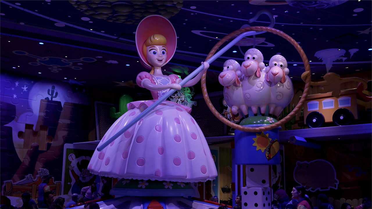 Statue of Bo Peep and her sheep inside a Toy Story themed dining room