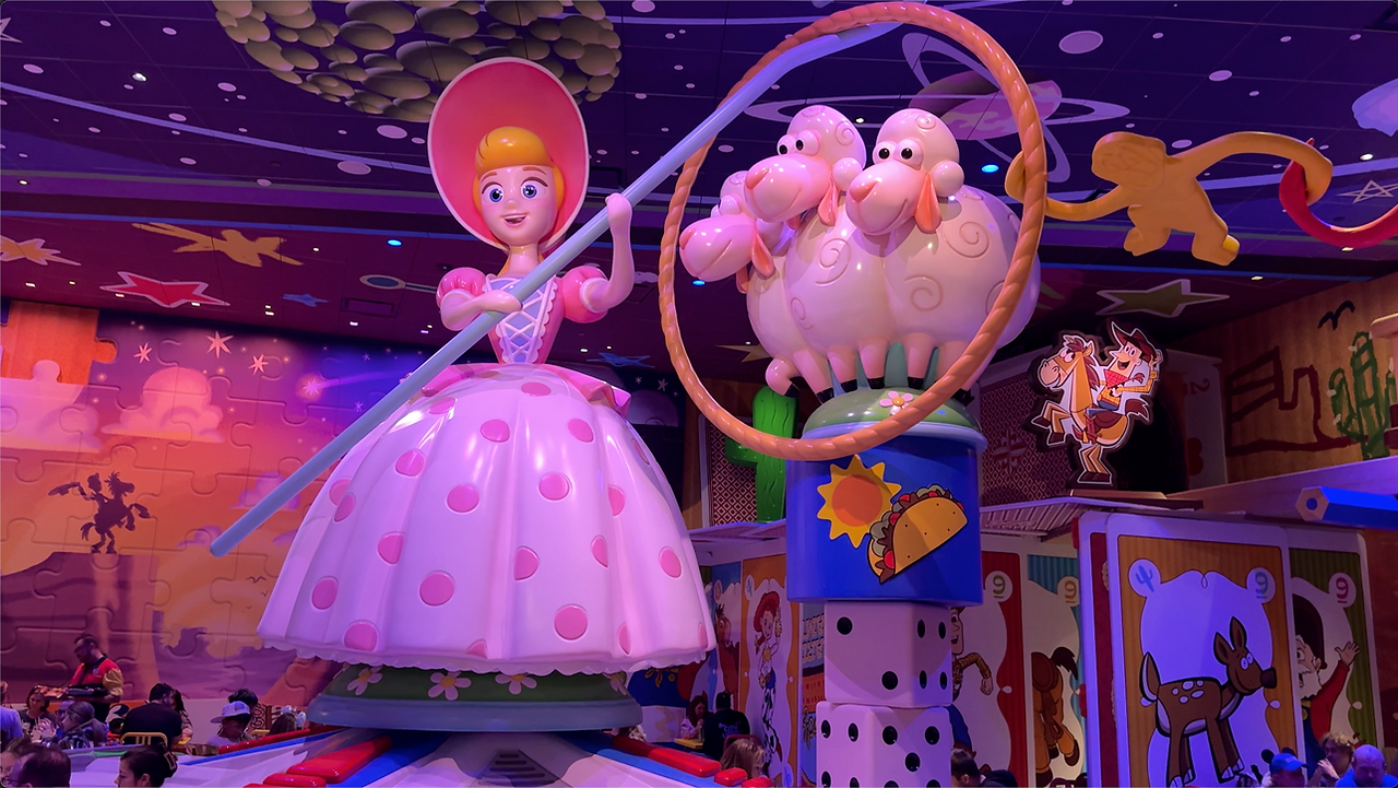 A statue of Bo Peep and her Sheep in a toy themed dining room