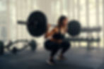 a woman weightlifting at the gym