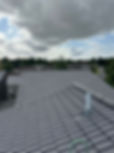 Multiple grey tiles roofs with new roof