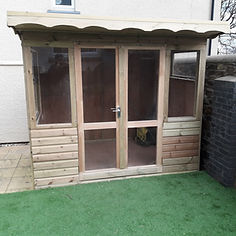 wooden shed with glass doors