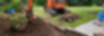 Digger machine excavating a lawn