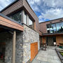 Modern home with patio and wooden façade