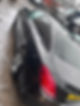 Black vehicle in the rain