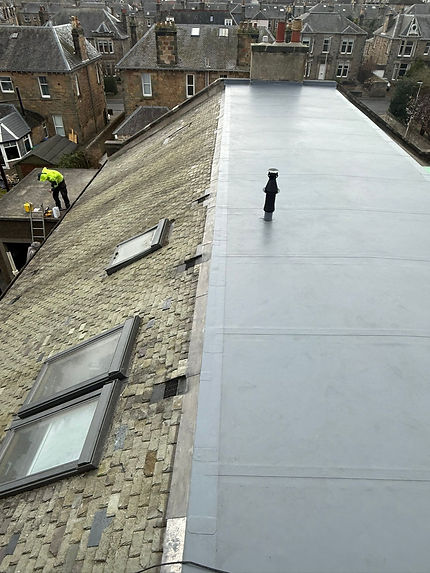 New flat roofing between sloped roof