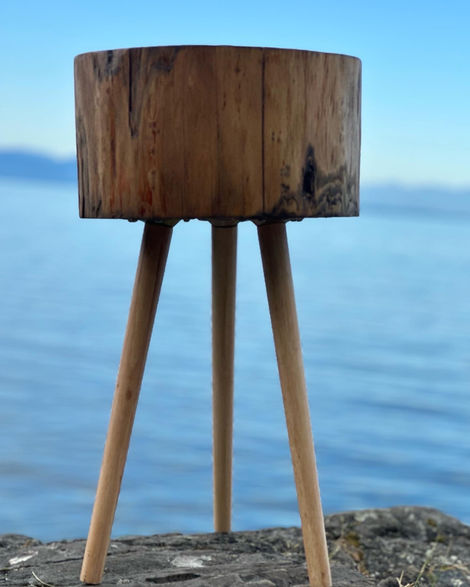 three-legged Douglas Fir stump-style side table. Turned wooden legs with a brushed rose gold finish. 