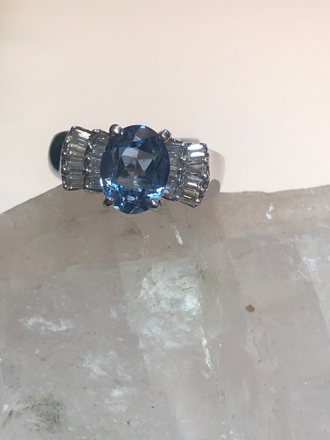 Blue topaz with diamond baguettes