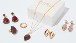 Jewelley Photography - Jewellery items grouped together on a white background with gift box.