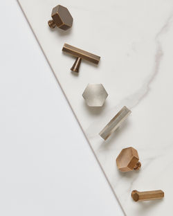 Creative Product Photography - Armac Martin brass kitchen door knobs displayed on marble.