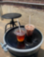 Ethica Coffee Roasters menu and outdoor seating with coffee cocktail and iced mocha